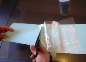Lift and cut the wax paper